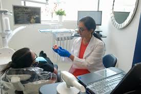 Dentist explaining treatment to a patient at Kaur Dentistry